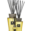 Baobab Collection TOTEM AURUM fragrance diffusers with black sticks and luxurious gold finish.